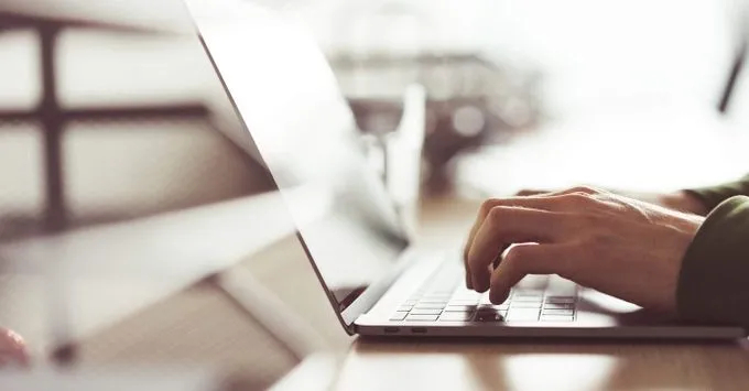 Freelancer spending long hours at laptop